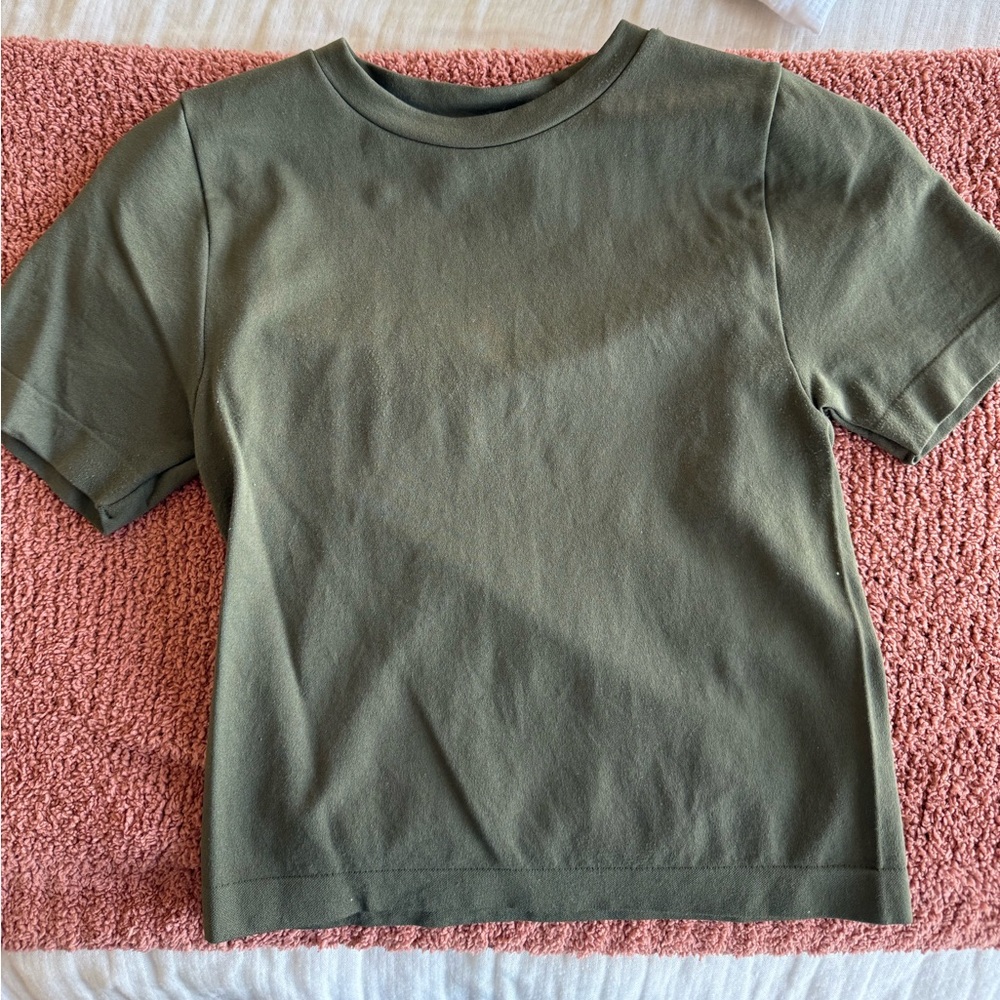 A new day army green spandex feel shirt. Size small.